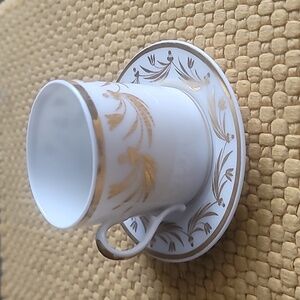 Vintage porcelain gold gilded coffee cup and saucer